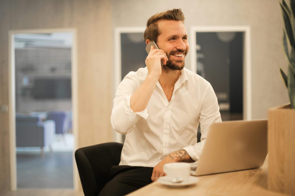 Man smiling on phone call