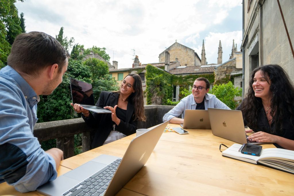 Outdoor meeting with laptops